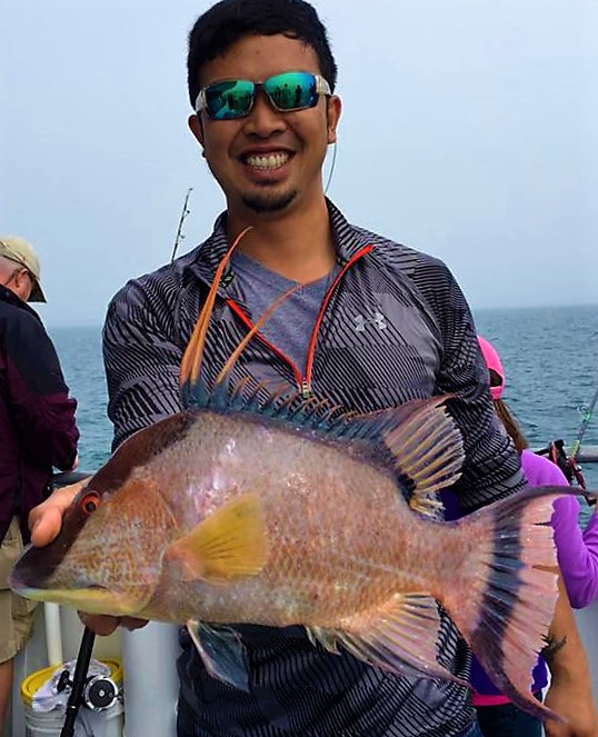 Ananthachai Nantakul from Tampa showing off a big all day hogfish from the 10 hour deep sea fishing trip at Hubbard's Marina