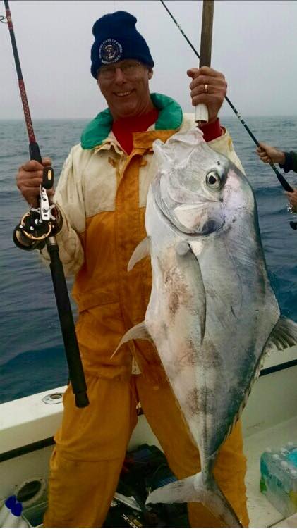 Captain Mark Hubbard showing off a big African Pompano from the Flying HUB 1 go fast private charter