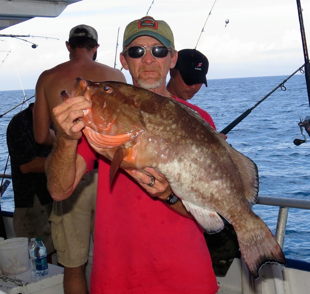 Captain Bryon Holland showing off a big red grouper