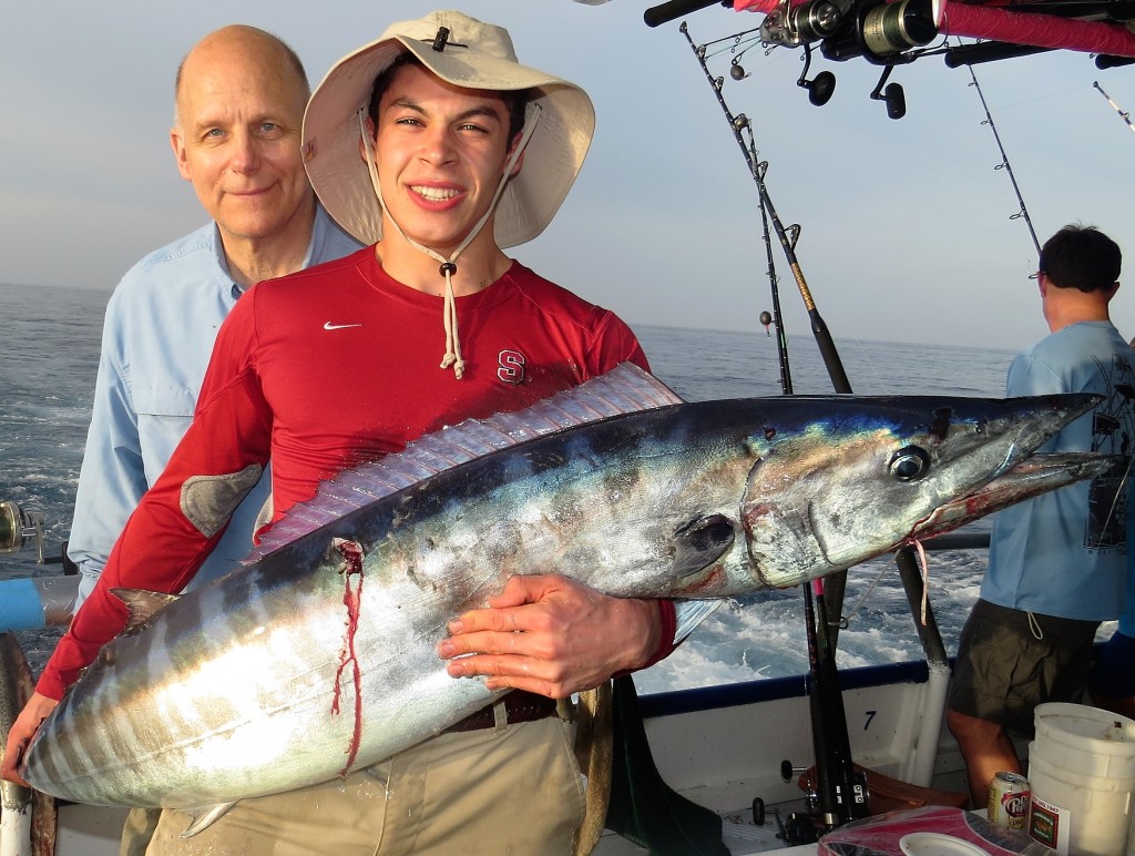 Left-Right- Guy Peterson and Alex Sandoval showing off the 55lb wahoo they caught during the 39 hour at Hubbard's trolling off our party boat