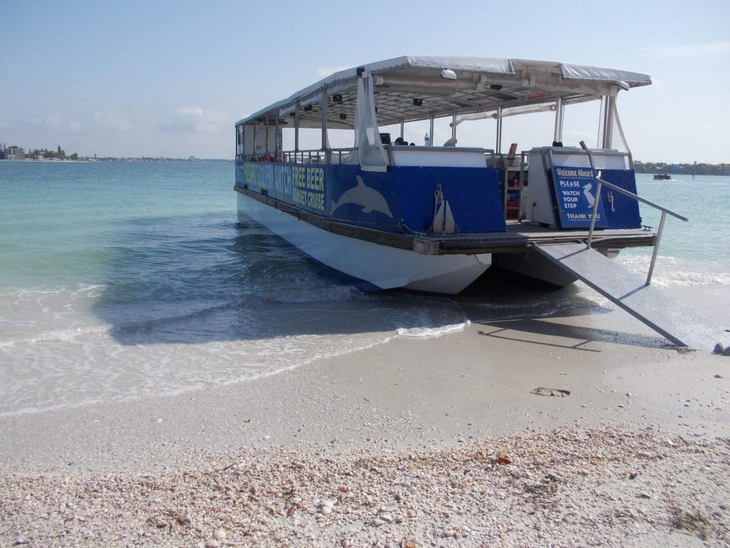 Beautiful view of the dolphin watching nature cruise and eco tour boat hanging on shell key waiting for the 3 hour shelling guests to return