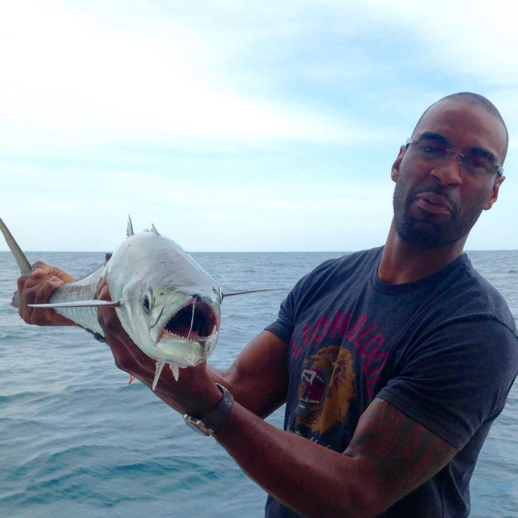 Calvin Johnson Jr. 'Megatron' showing off a kingfish he caguht while private charter fishing on the Mrs. HUB at Hubbard's Marina