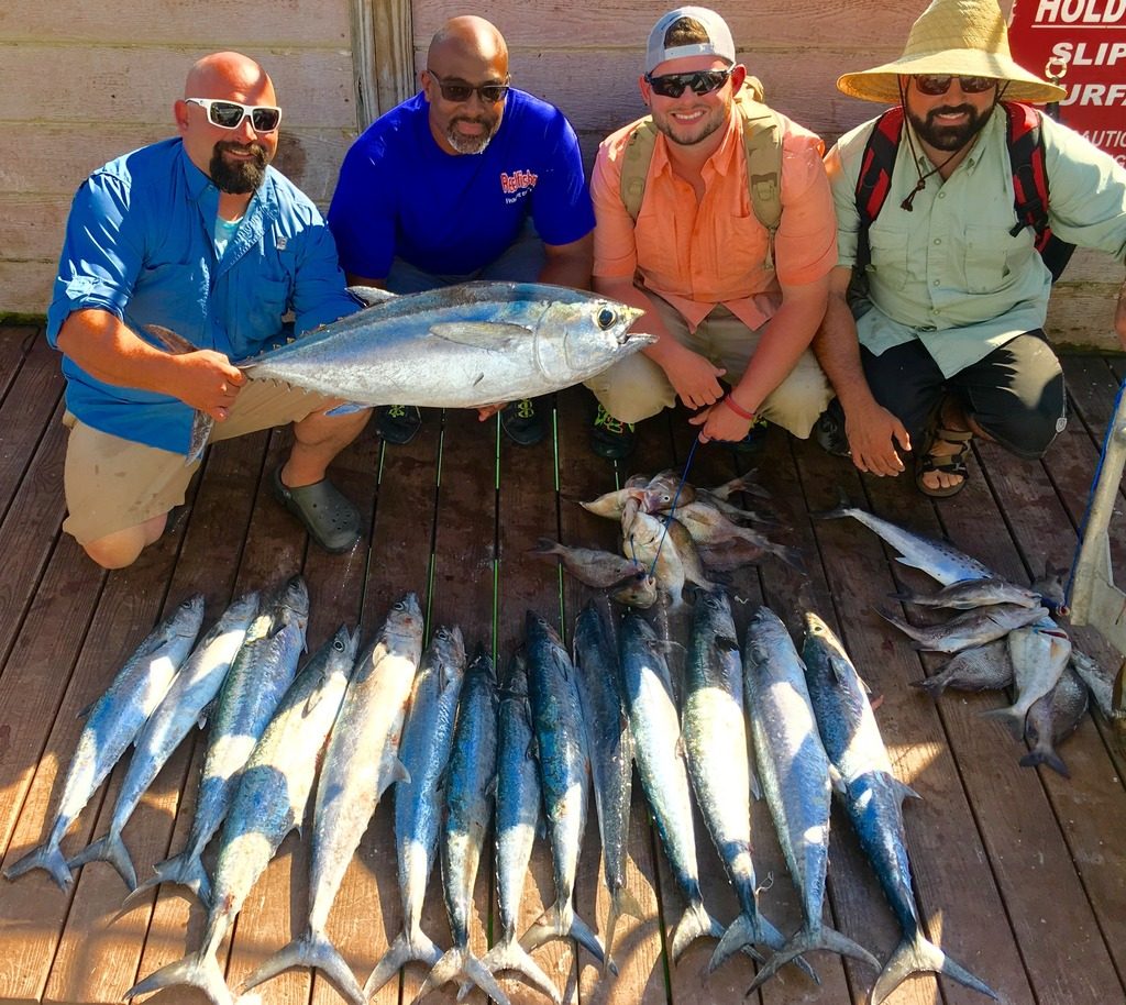 Left-Right-Captain Frank, Allen Miller, Patrick Venegas,Frederick Carvalho showing off kingfish and tuna caught on a 10 hour all day fishing trip at Hubbard's Marina