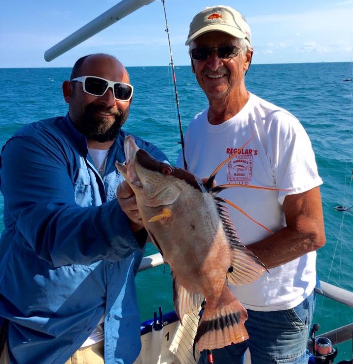 Left-Right- Captain Frank and Bill Stringer showing off bill's beautiful hogfsih from a 5 hour half day at Hubbard's Marina