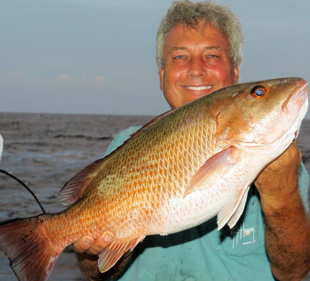 Bo Janecka showing off a beastly sized mangrove snapper caught on a 39 hour out of Hubbard's Marina