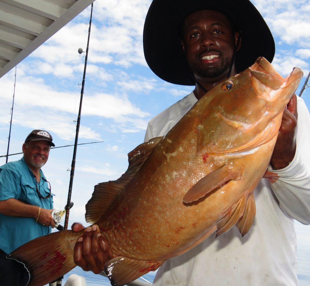 Jeff Dixon, a St. Pete local, showing off a Nice 39 hour red grouper at Hubbard's marina