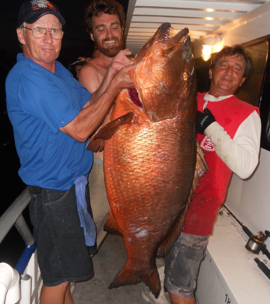 Left-Right Van cline, Capt Garett Hubbard and Ritchie Gollis showing off a 111lb cubera snapper caught on the 39 hour at Hubbard's Marina