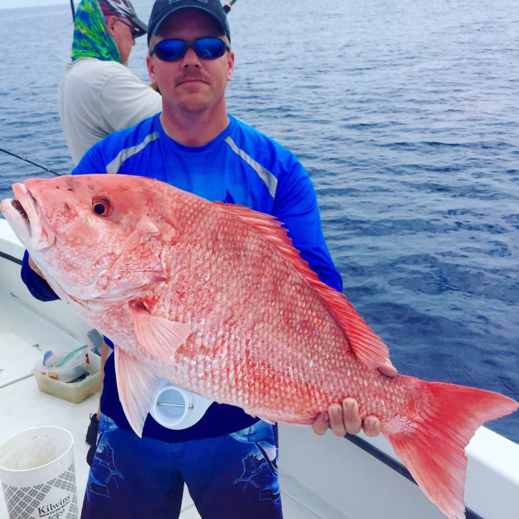 Robert Brooks from Riverview showing off a beautiful red snapper from the Flying HUB 1 private charter