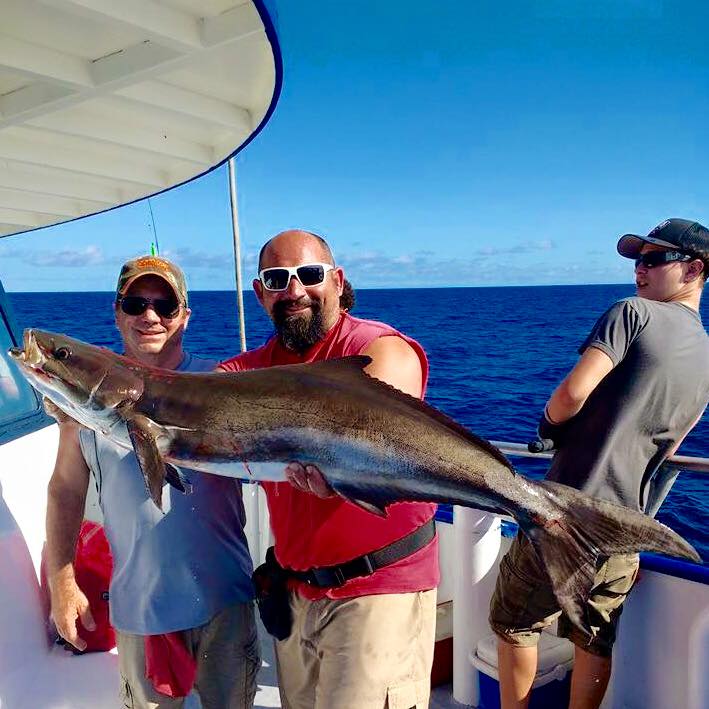 Left-Right- Frankie Henry showing off a cobia he caught on the 10hr all day at Hubbard's Marina and Captain Frank Bacheler